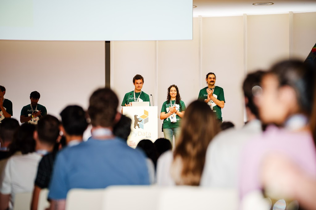 PyData Berlin organizers on stage in front of the conference audience